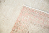 Hand-knotted foundation of a Vintage Turkish Oushak rug, showing blush and neutral weave.