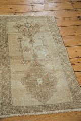 Vintage Oushak rug's unique truncated medallion and pale wooded tones.