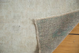 Distressed Oushak rug runner pile, hand-knotted foundation, and fringe with green hints.