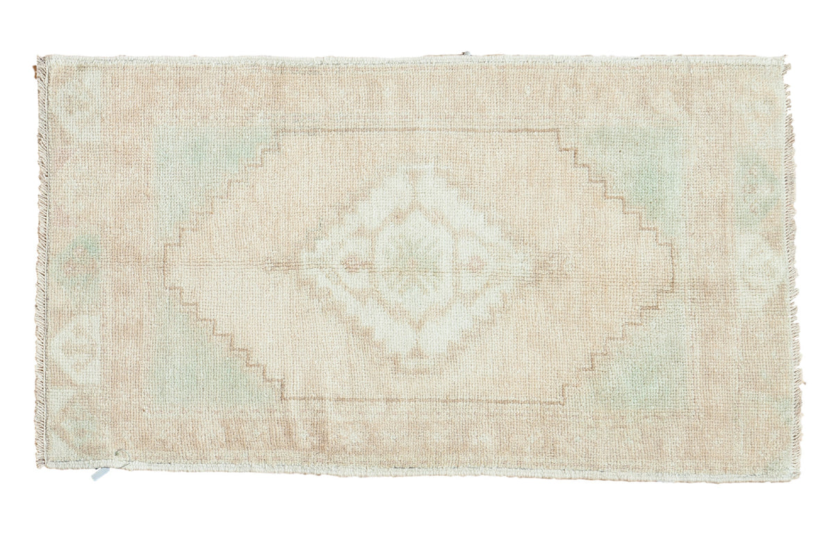 Vintage Oushak runner, serrated diamond medallion, reciprocating spandrels, blanched beige and pale mint green.