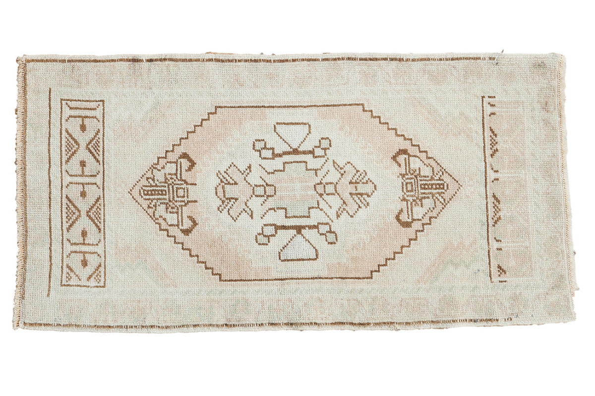 Vintage Turkish Oushak runner, pale blush medallion, ivory field, chocolate brown spandrels. 1'8" x 3'4".