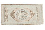 Vintage Turkish Oushak runner, pale blush medallion, ivory field, chocolate brown spandrels. 1'8