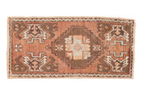 Vintage Oushak rug mat with a stepped medallion, bronze, chocolate, and ivory geometric plant motifs.