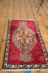 Thick pile, cherry red field, geometric border, and fringe of vintage Oushak runner.