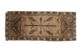 Vintage Oushak runner with central serrated leaf design in pale peach, charcoal, turquoise, and ivory, 1'7