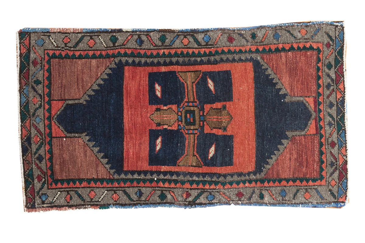 Vintage Turkish Oushak rug runner with bold rectilinear navy, tangerine, and red patterns.