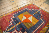 Vintage Oushak rug, pinwheel diamond center motif with tangerine, saffron, and ivory.