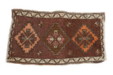 Hand-knotted vintage Oushak rug mat with triple diamond medallions, plum brown, tangerine, blush.