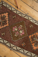 Thick pile vintage Oushak rug featuring chocolate brown diamond medallion, blush rose, tangerine.