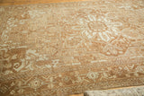 Antique Karaja rug's geometric central medallion, with serrated leaves in pale bronze and ivory.