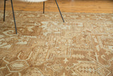 Detail of antique Karaja rug showing serrated geometric motifs in pale bronze and ivory.