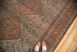 Vintage Persian Shiraz carpet detail, pale blue field, geometric border, and low pile.