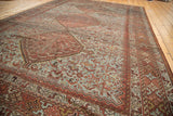 Vintage Shiraz rug: pale blue field, chestnut brown bird motifs, and textured knot heads.