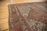 Close-up of vintage Shiraz carpet, pale blue field with bird motifs, and distressed chestnut brown border.