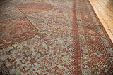 Vintage hand-knotted Shiraz rug's pale blue field, depicting bird and plant motifs.