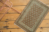 Distressed vintage Sivas rug mat with mir boteh motif in blush, antique ivory, charcoal brown.