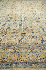 Worn texture of distressed North West Persian carpet border with faded navy, saffron, and sky blue.
