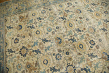 Distressed North West Persian carpet detail: allover lattice in faded blues, saffron, ivory.