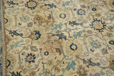 Distressed ivory field with navy, sky blue, saffron Persian rug pattern, foundation visible.