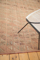 Vintage Turkish Jijim rug's secured edge, with faded blush squares and diagonal embroidered motifs.