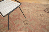 Geometric panels and asymmetric color fills on vintage Turkish Jijim carpet.