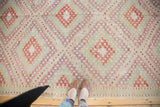 Vintage Turkish Jijim rug with repeating diamond motif in ivory, aubergine, cherry red, saffron yellow.