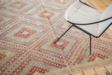 Vintage Turkish Jijim carpet's geometric diamond lattice in aubergine, cherry red, and ivory.
