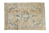 Faded sand and indigo Persian Tabriz carpet with quatrefoil medallion and floral design.