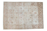 Distressed Persian Tabriz carpet, ornate Safavid Kerman vase motif, softened ivory, blush, and wooded tones, 9'3