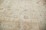 Distressed vintage Persian Tabriz carpet section with intricate Kerman vase motifs and even wear.