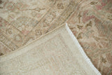 Vintage distressed Tabriz carpet pile with even wear, exposed foundation, and ivory, blush hues.