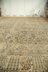 Distressed vintage Tabriz carpet with reciprocating floral border and willow tree motifs.
