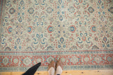 Distressed vintage Kaisary border and patterned field in teal, ivory, pomegranate red.