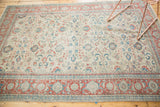 Distressed vintage Turkish Kaisary carpet border in pomegranate red with teal and ivory palmette motifs.
