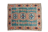 Vintage Turkish Oushak rug with triple medallions, abrashed blue-green field, and terra cotta floral border.