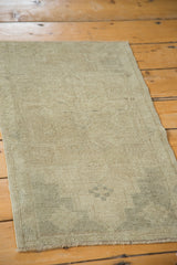 Vintage Oushak runner with subtle tone-on-tone geometric pattern in ivory and beige.
