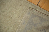 Natural beige hand-knotted foundation and secured side of the vintage Oushak rug.