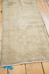 Vintage Oushak rug's hand-knotted texture with beige abrash striations and border detail.