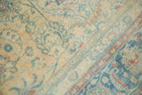 Distressed Meshed carpet featuring faded beige, ink blue vinery, lotus, apricot accents.