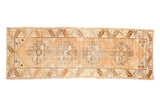 Vintage distressed Oushak runner, geometric medallions on faded tangerine saffron field, 3'1