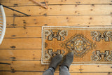 Unusual tangerine orange vintage Oushak runner with stepped diamond medallion and plant motifs.