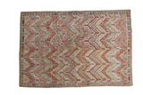 Vintage hand woven Turkish Jijim rug with blanched blush, ivory, gold, and charcoal chevron pattern.