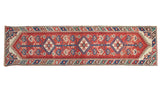 Vintage Dosmealti runner with cherry red field, triple medallions, blue motifs, and barber pole border.