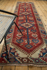 Secured fringe and barber pole border with ivory, blue, red on the Turkish Dosmealti runner.
