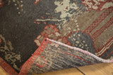 Hand-knotted underside, secured red edge, and charcoal floral pattern of vintage Oushak runner.