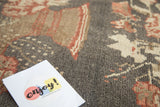Hand-knotted Oushak rug pile, charcoal field with European-flair wine red and ivory florals.