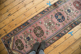 Geometric vintage Turkish Dosmealti runner featuring blush field and alternating rams horn medallions.