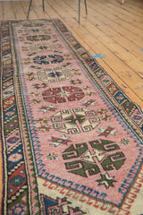 Blush field and geometric rams horn medallions on vintage Dosmealti runner detail.