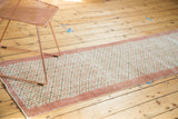 Blush and ivory quatrefoil floral lattice on a distressed vintage Oushak runner.