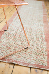 Distressed blush quatrefoil diamonds in lattice on ivory vintage Oushak runner.